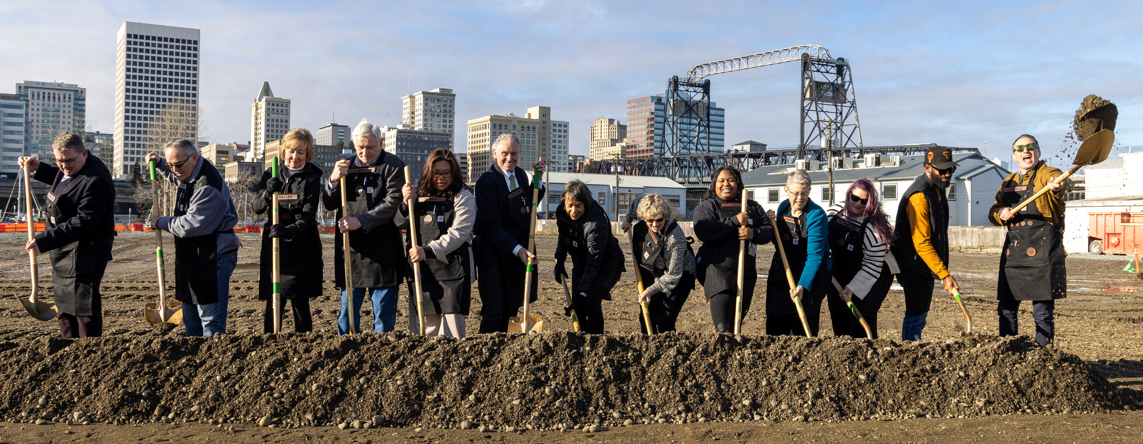 Elected officials and executive directors from the Port of Tacoma and the Tacoma Public schools ceremonially break ground at an event for the Port Maritime Center project Jan. 8, 2025.