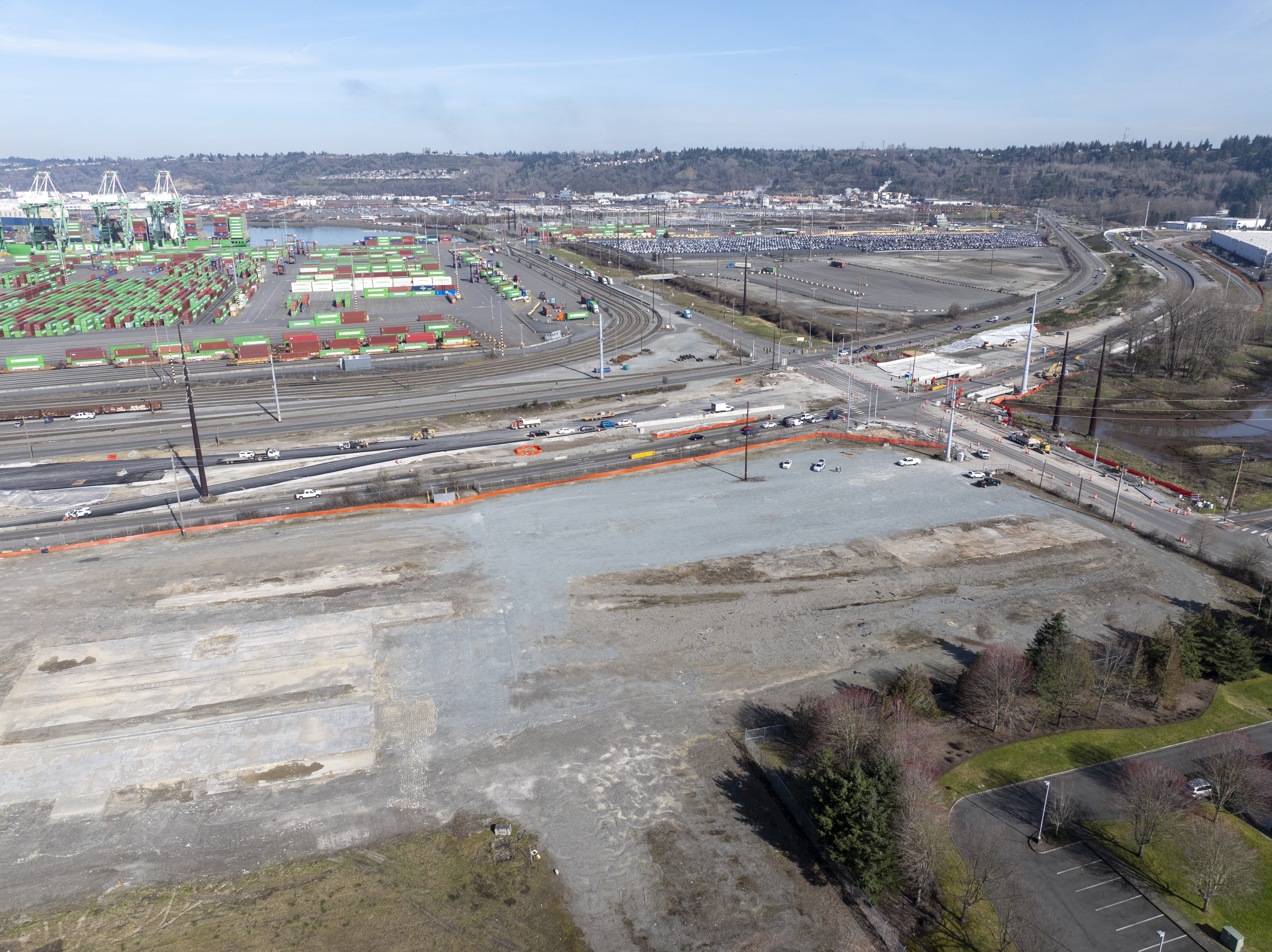 Aerial photo of vacant land near a highway and Port terminal on a sunny day.